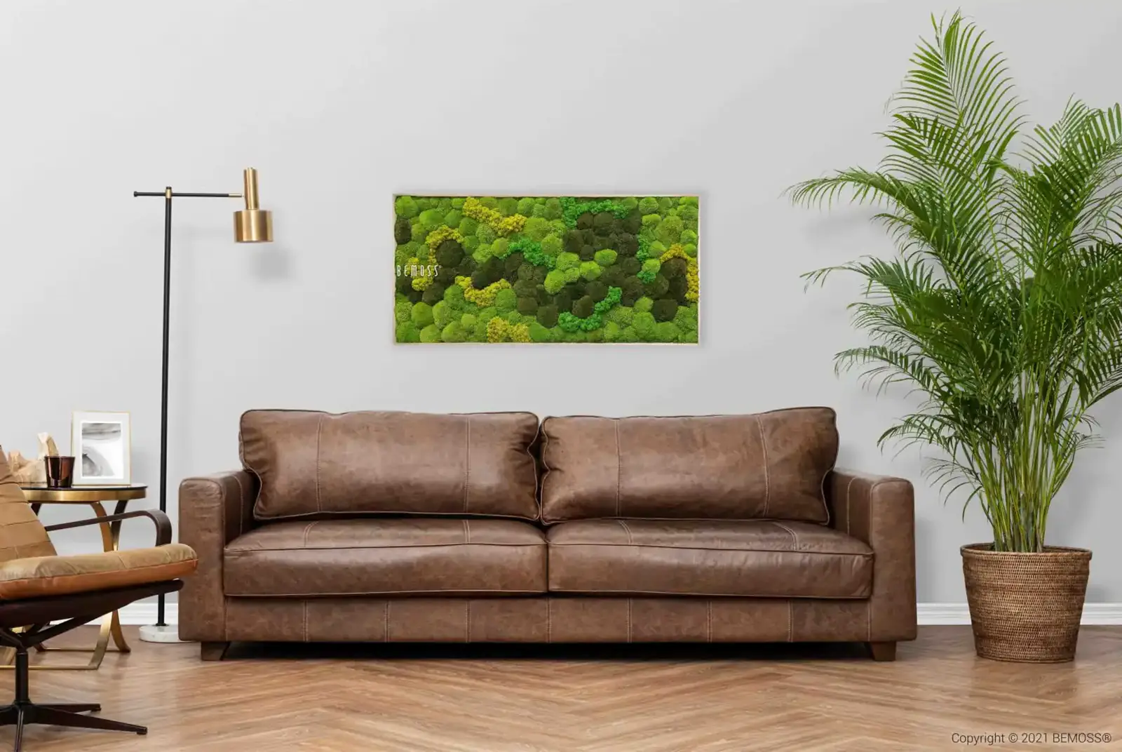 Living room mockup showing a rectangular moss wall art panel above a sofa