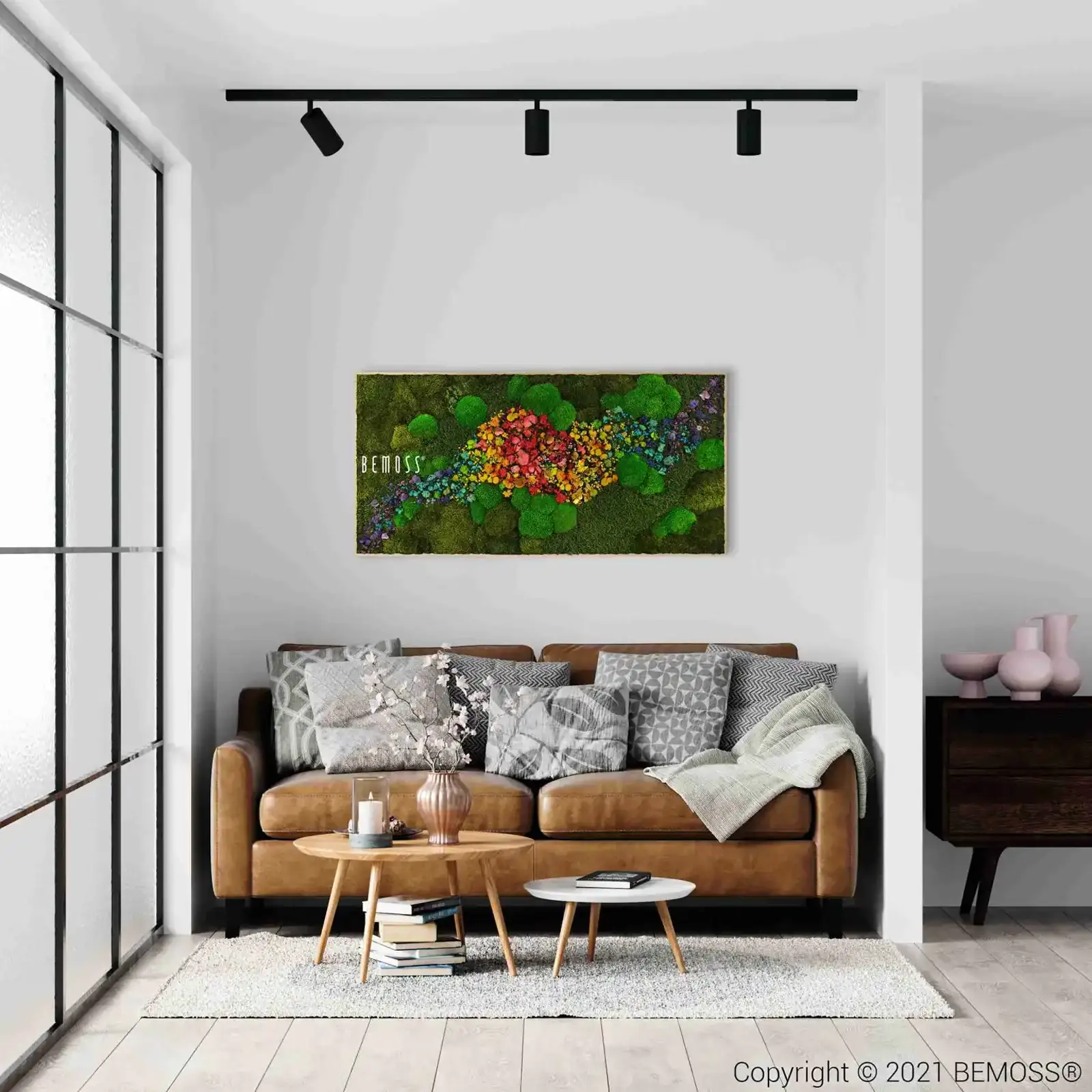 Interior mockup with framed moss art displayed above a couch in a modern room