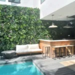 poolside faux green wall installation